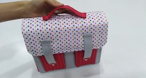 Álbum con maletita en tela.