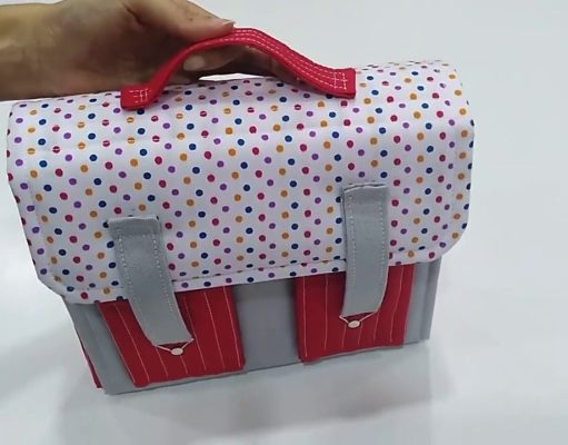 Álbum con maletita en tela.